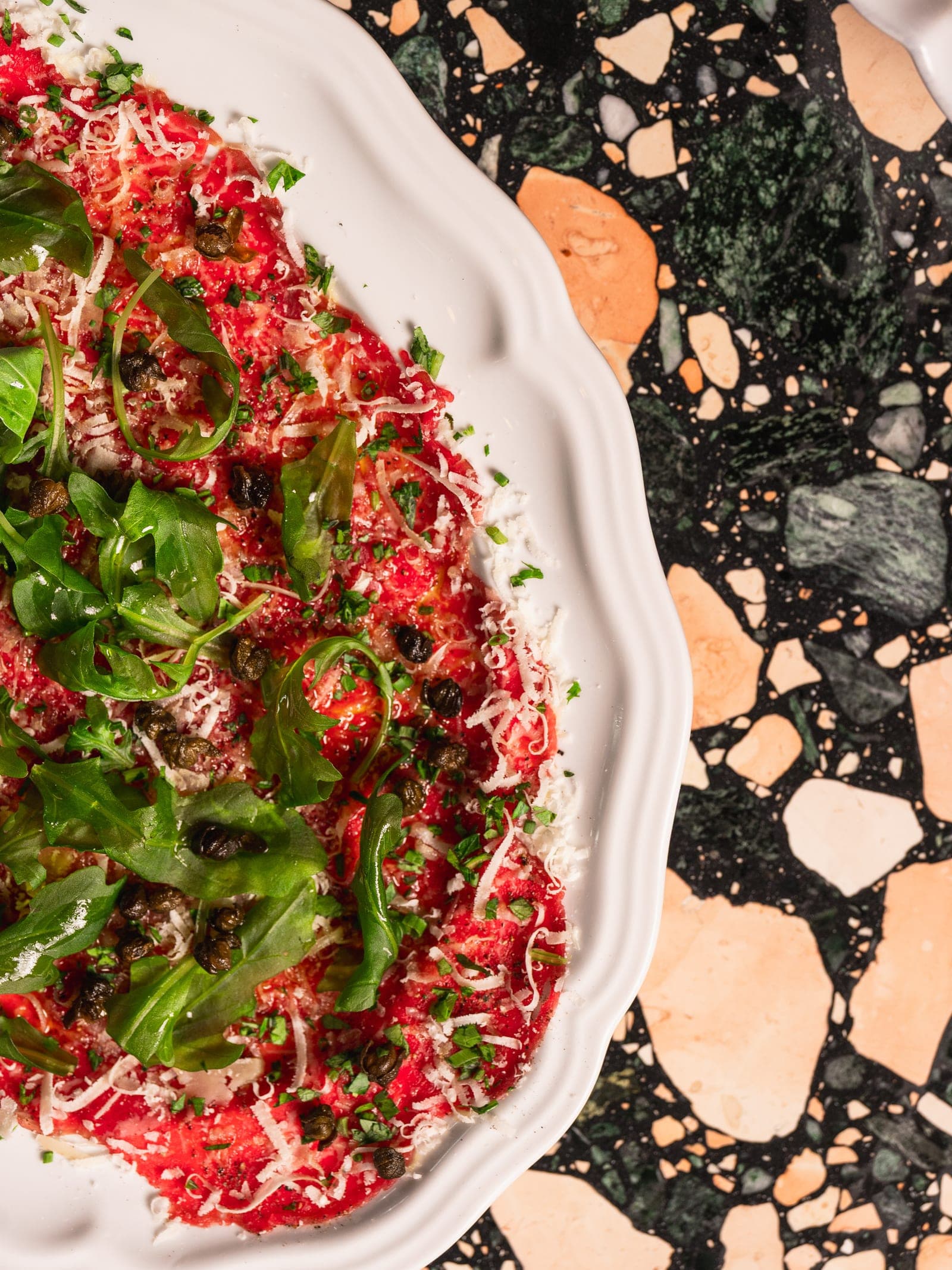 Wagyu beef carpaccio with parmigiano and arugula