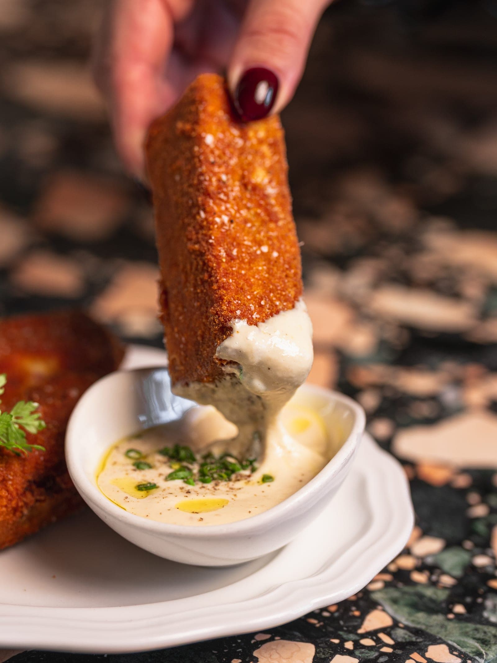 Mozzarella en carrozza dipped in bagna cauda burro