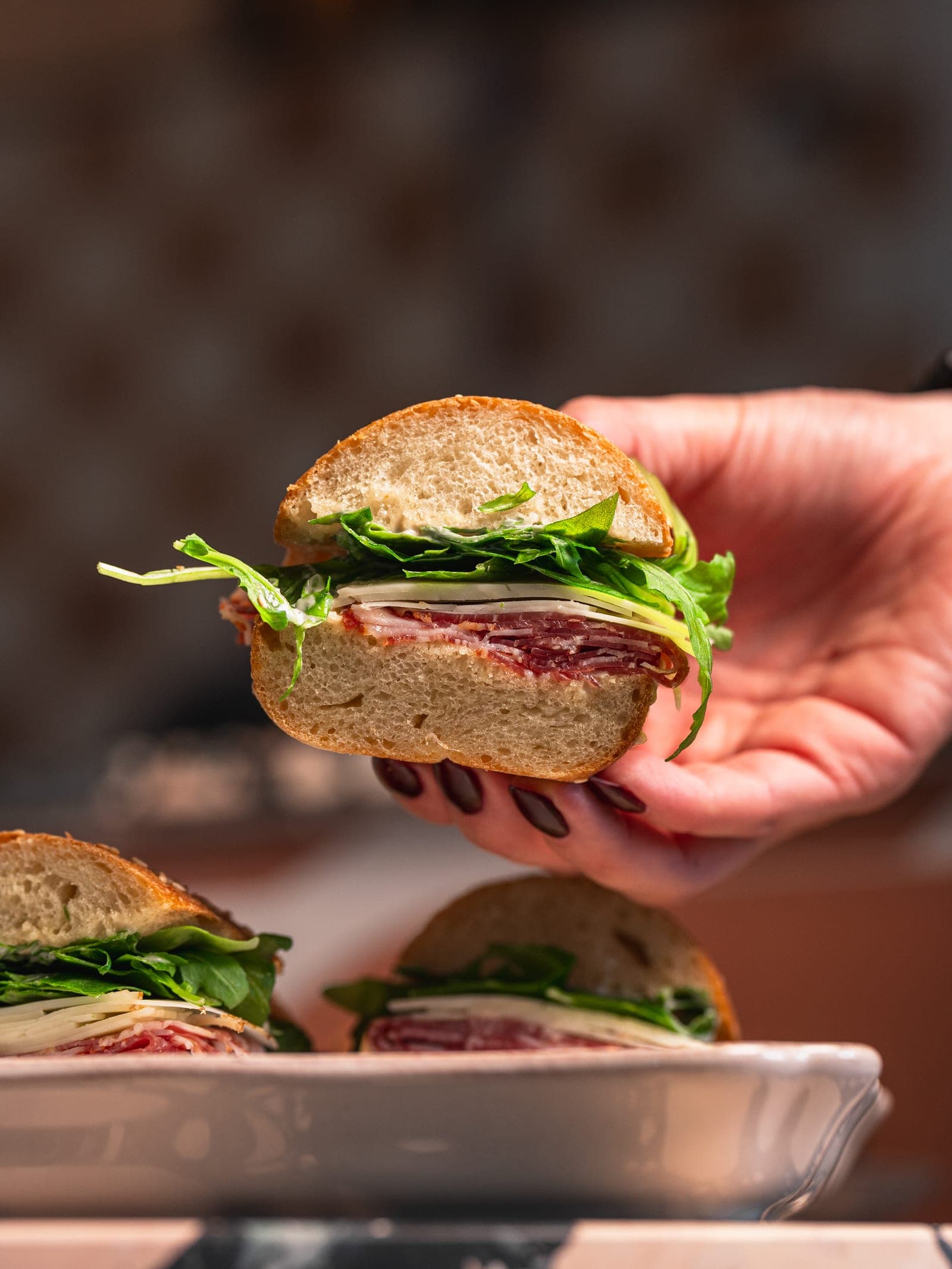 A panuozzo sandwich in hand