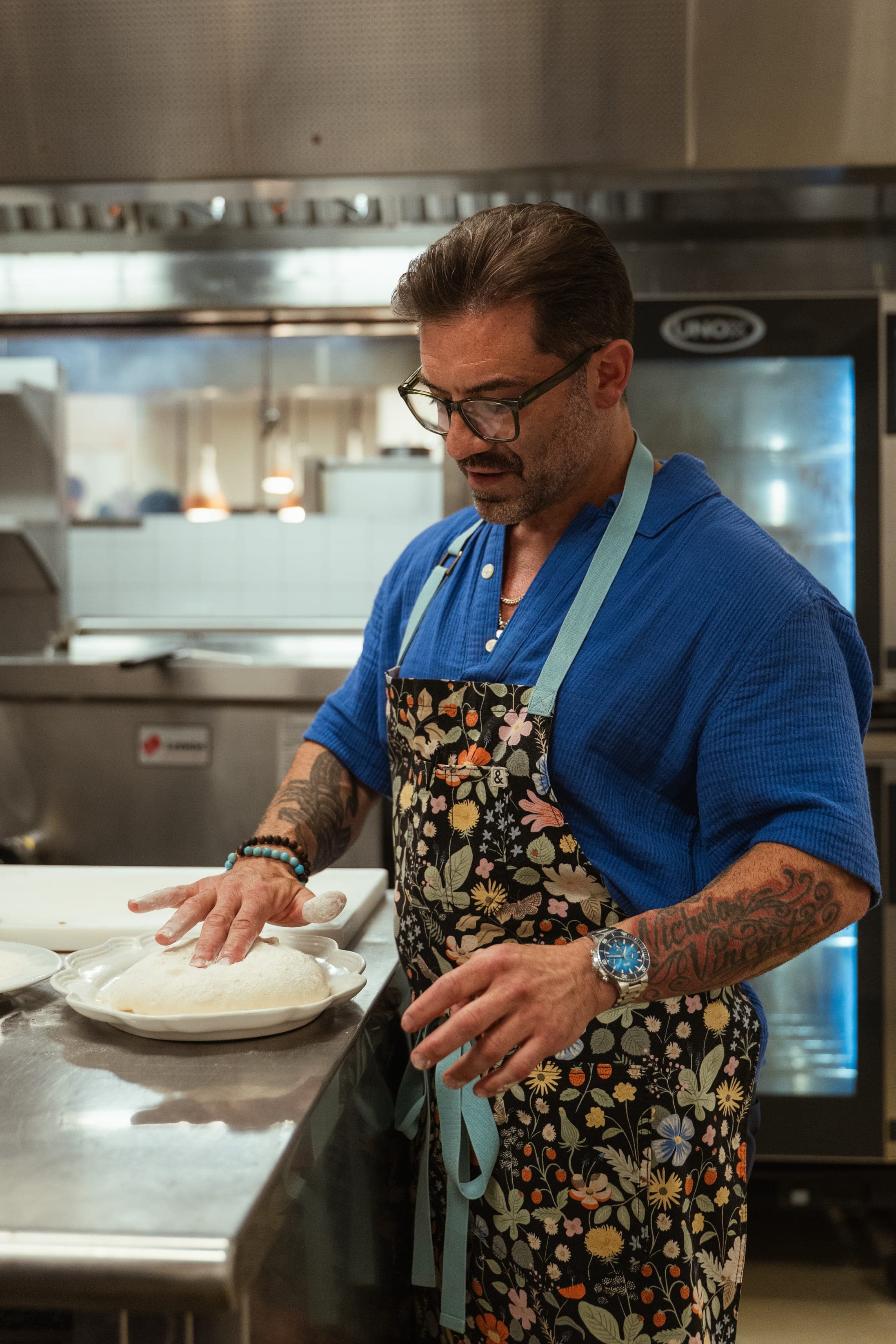 Chef Ryan DePersio pressing dough on the board