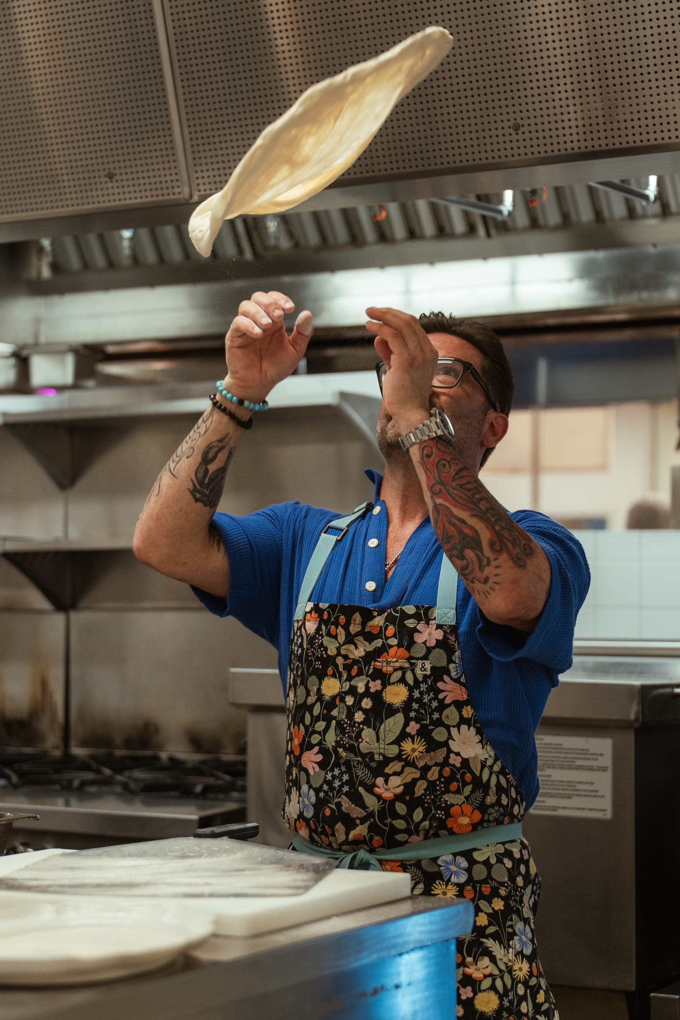 Chef Ryan DePersio tossing pizza dough