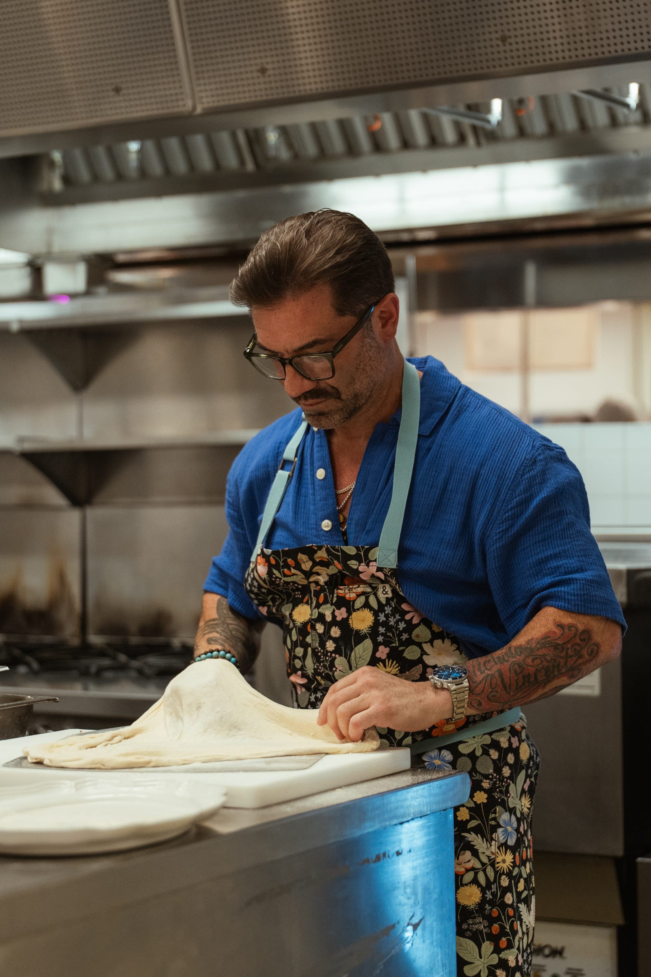 Chef Ryan DePersio laying out dough